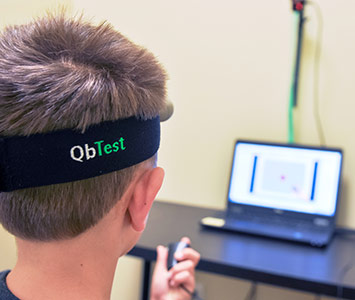 young boy taking QbTest for ADHD at Greenville ADHD Specialists office